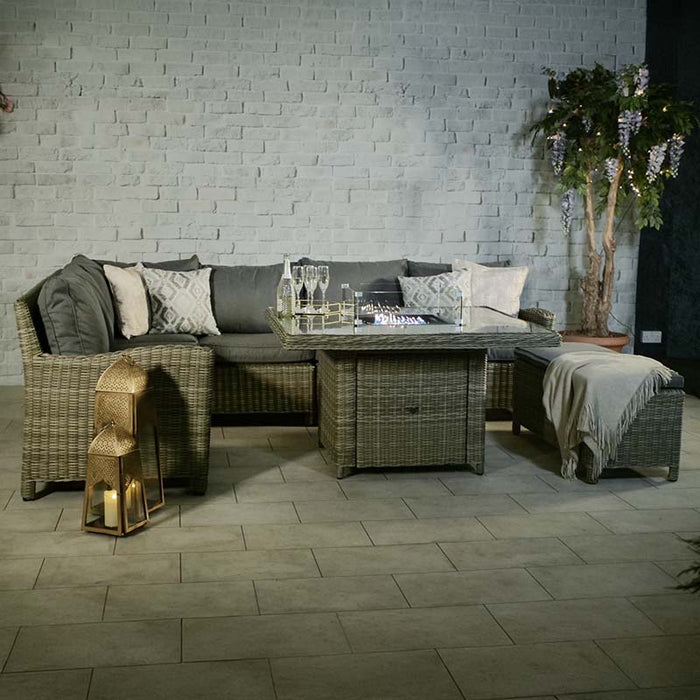 Wentworth Fire Pit Corner Dining Set with square table, showcasing a comfortable arrangement with grey cushions in a chic indoor setting.