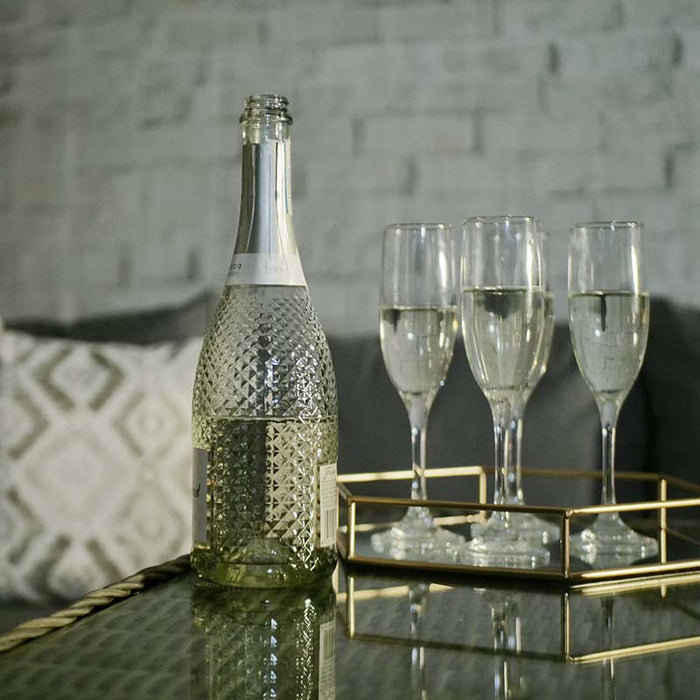 Chic bottle and glasses set on the Wentworth Fire Pit Dining Set’s square table, ready for a stylish outdoor celebration.