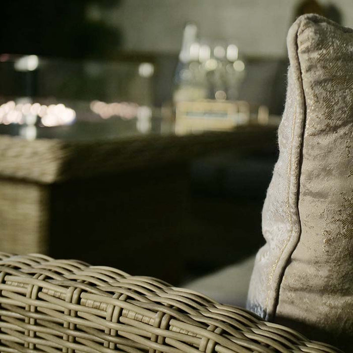 Close-up of the elegant rattan texture and soft cushion on the Wentworth Fire Pit Dining & Lounge Set, perfect for a cosy evening.