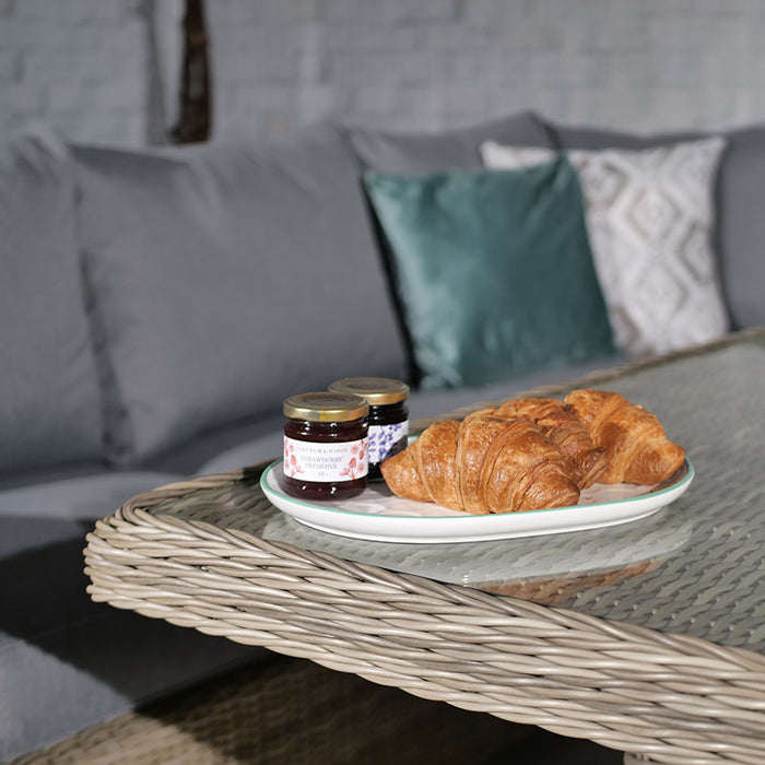 Close-up of a plate with croissants and jams on the Wentworth Fire Pit Dining Set’s square table, showcasing a cosy breakfast setup.