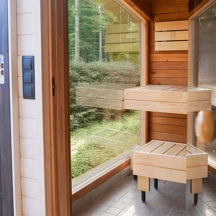 Woodnest Maria 2-4 Person Outdoor Sauna interior with large window, timber seating and bright changing area.